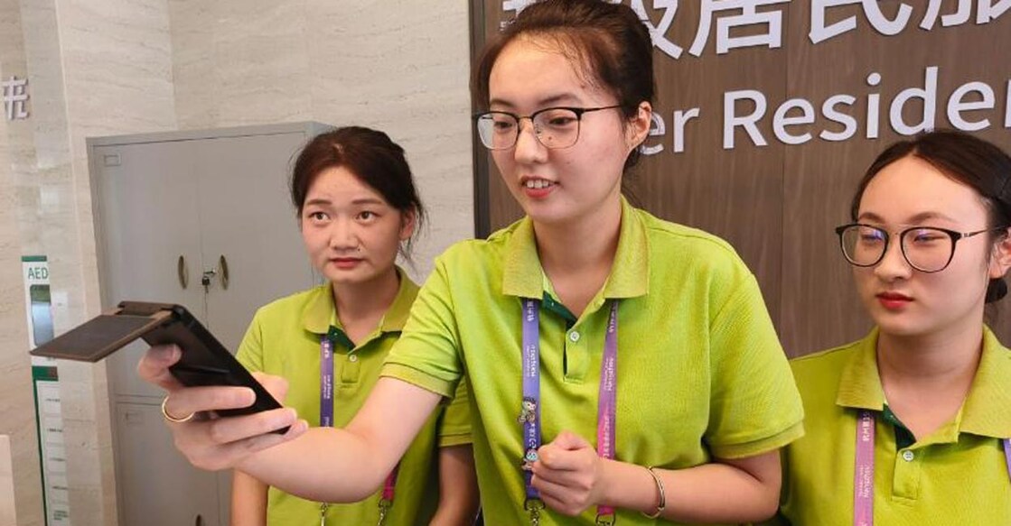Volunteers with the AI-powered translation tool. 