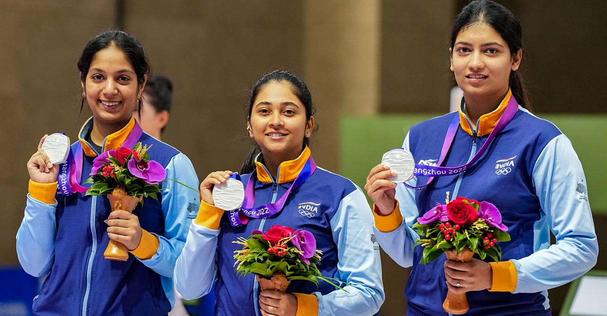 From left: Ramita Jindal, Mehuli Ghosh and Ashi Chouksey celebrate on the podium. Photo: PTI/Shailendra Bhojak