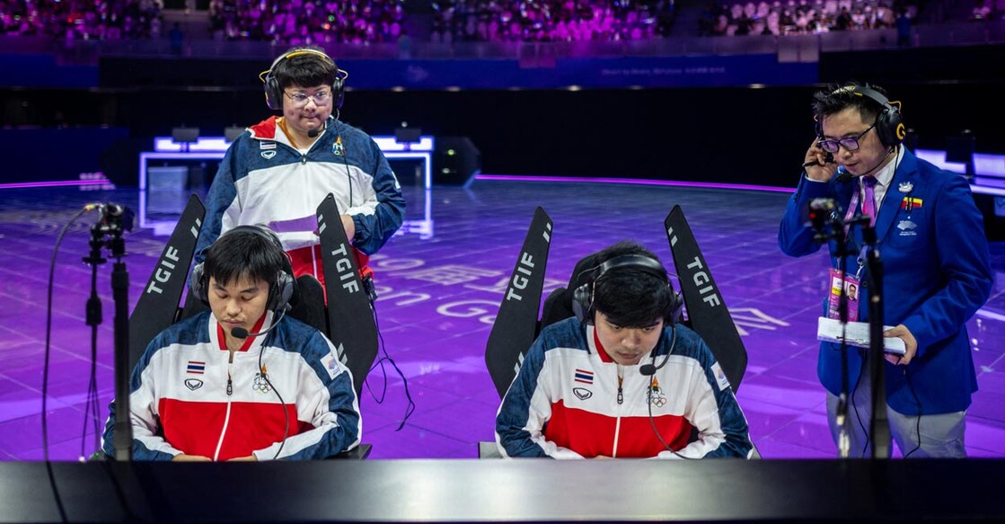 Thailand's Anusak Manpdong, left, prepares for the 'Arena of Valor' Asian Games version bronze medal match. File photo: AFP/Philip Fong