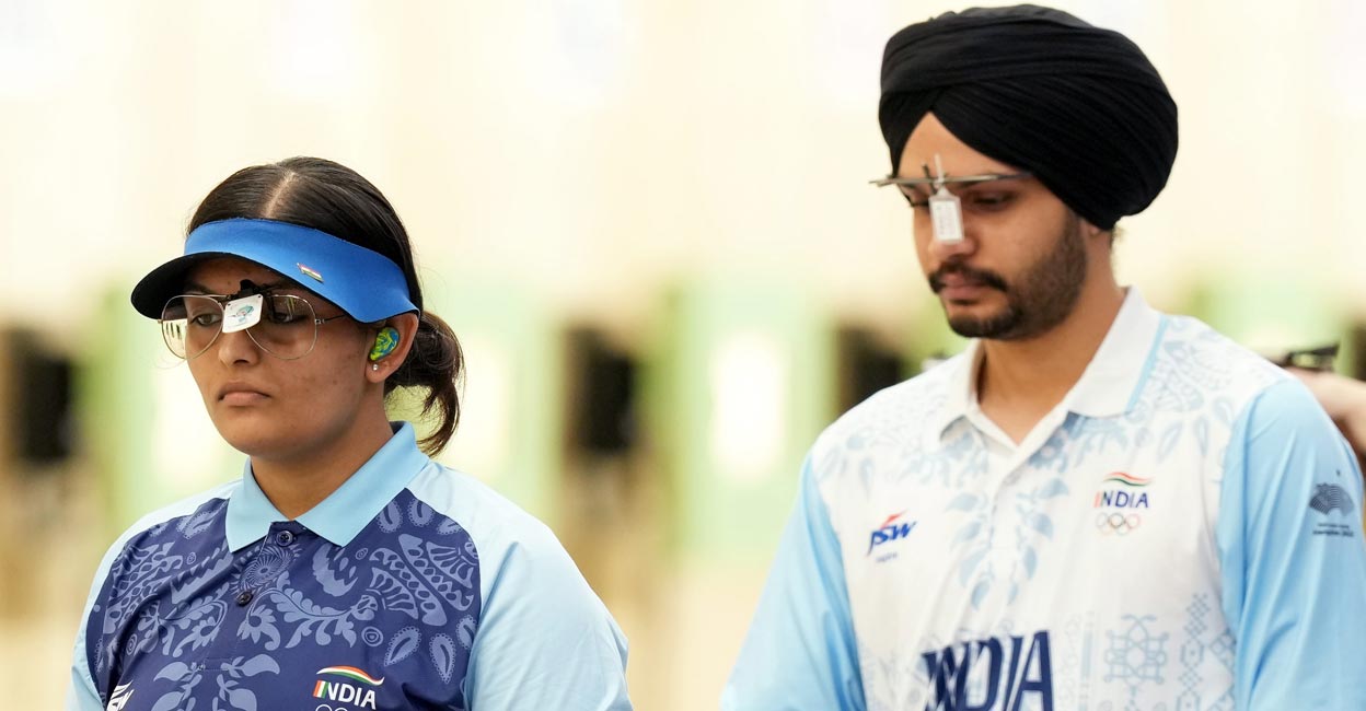 Divya T S and Sarabjot Singh compete in the 10m air pistol mixed team gold medal match. Photo: PTI/Shailendra Bhojak