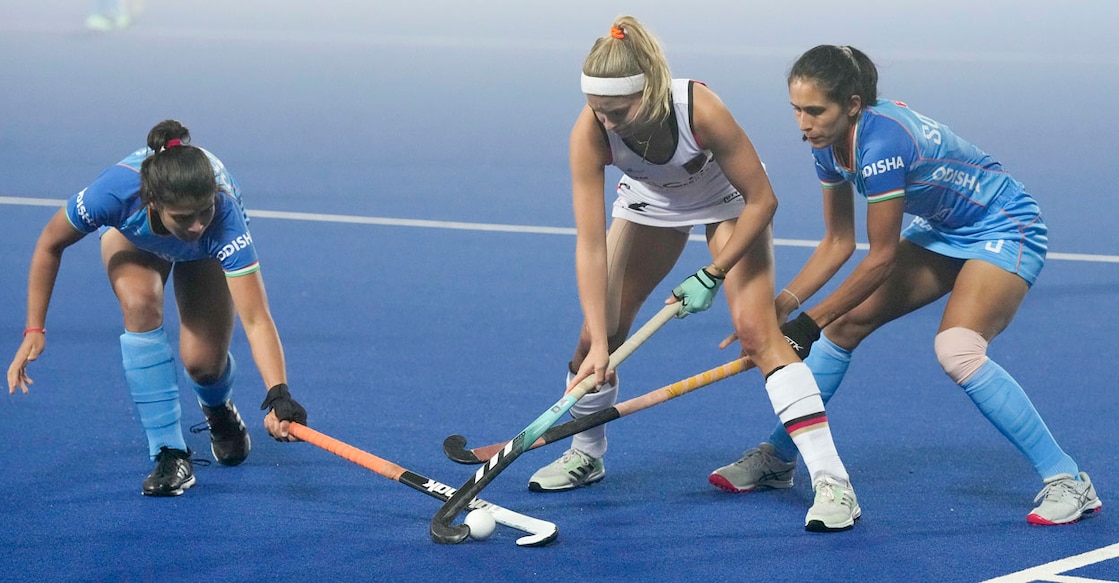 India's Deepika (left) and Sonika challenge Germany's Kira Horn during the FIH Women's Olympic Qualifiers match at Marang Gomke Jaipal Singh Astro Turf Hockey Stadium in Ranchi on Thursday. Photo: PTI