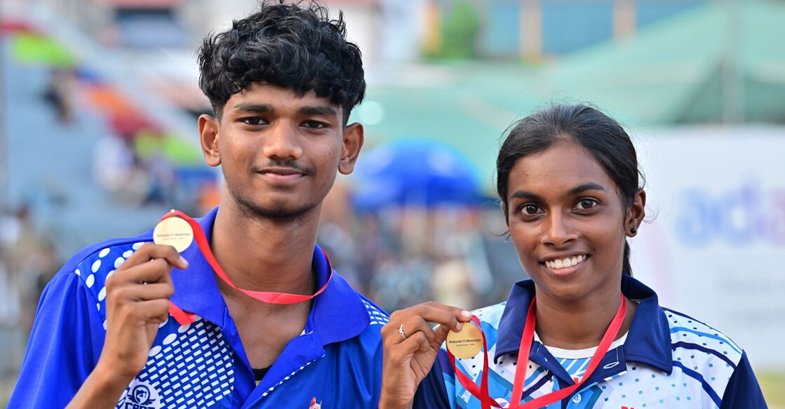 Mohammed Ashfaq and Jyothika M pose with the gold medals for best athletes presented by Malayala Manorama. Photo: Manorama 
