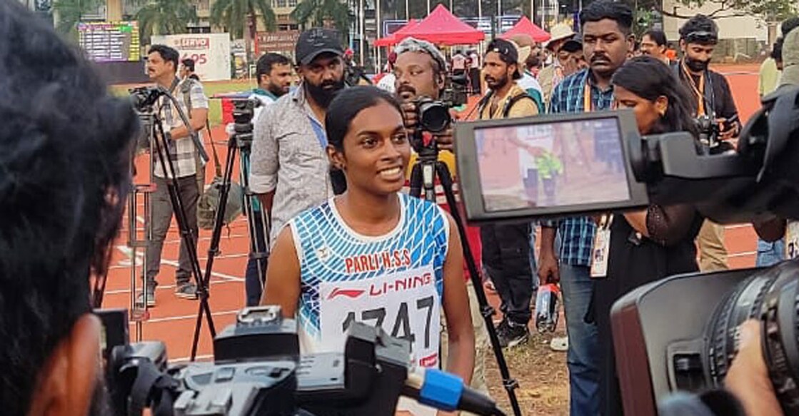Jyothika M of Palakkad poses after taking gold in senior girls' 400 m race at Kerala School Games. Photo: Onmanorama