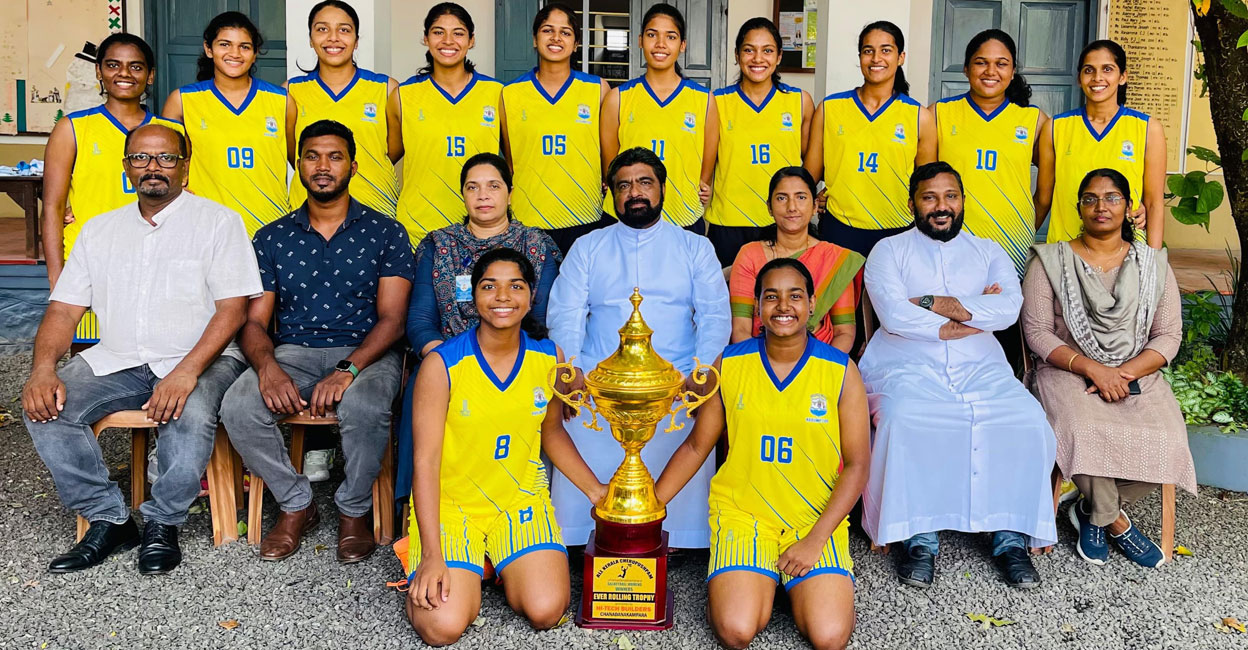 Players of Assumption College, Changanassery pose with the trophy. Photo: Special arrangement
