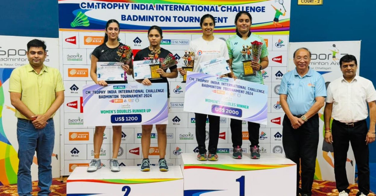 badminton-arathi-varshini.jpg Arathi Sara Sunil (white shirt) and Varshini V S pose on the podium, alongside silver medallists Kavya Gupta and Radhika Sharma, after winning the women's doubles title of CM Trophy International Challenge Badminton Tournament in Raipur on Sunday. Photo: Special arrangement