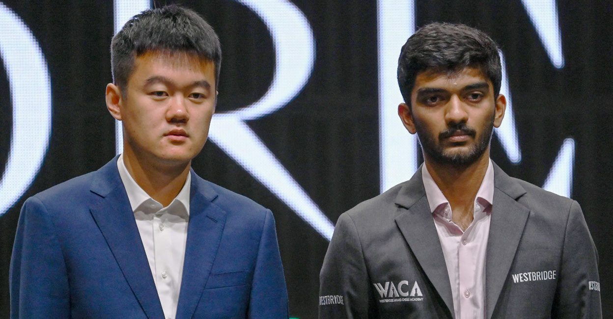 Chess grandmasters Ding Liren (left) of China and D Gukesh of India pose after a press conference ahead of the FIDE World Chess Championship in Singapore. Photo: AFP/ Roslan Rahman