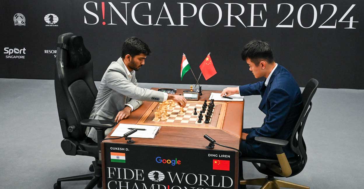China’s chess grandmaster Ding Liren (right) and Indian GM D Gukesh compete in game one of the FIDE World Chess Championship in Singapore on November 25, 2024. Photo: AFP/ Roslan Rahman
