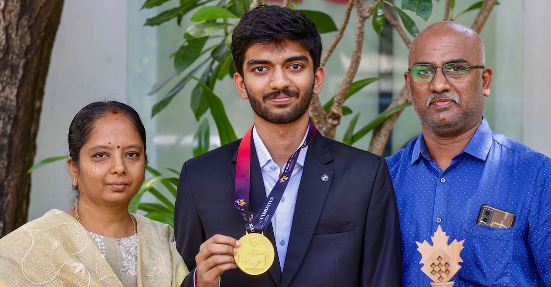 D Gukesh poses with his parents Padma Kumari and Rajnikanth after winning the Candidates Tournament. File photo: PTI