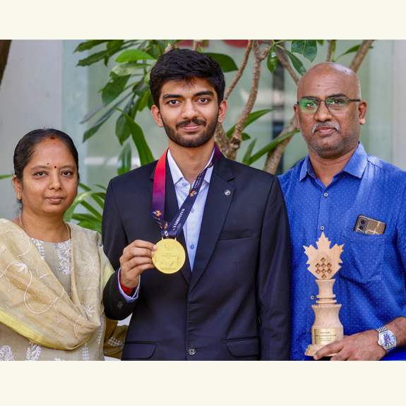 PTI04_28_2024_000088B D Gukesh poses with his parents Padma Kumari and Rajnikanth after winning the Candidates Tournament. File photo: PTI