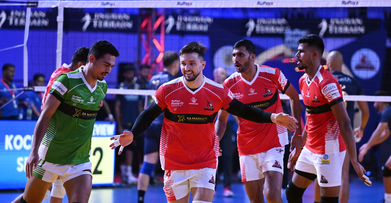 Calicut Heroes' players celebrate a point against Kochi Blue Spikers. Photo: Prime Volleyball League