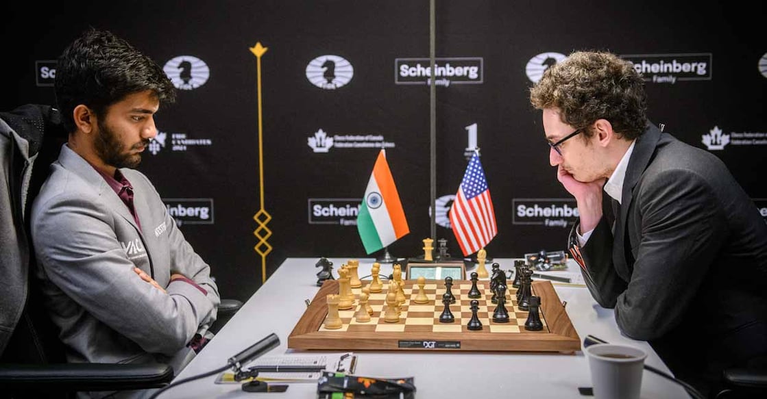 PTI04_18_2024_000033A Toronto: Grandmaster D. Gukesh of India and Grandmaster Fabiano Caruana of USA during their Round 11 match at the FIDE Candidates 2024 chess tournament, in Toronto, Canada, Wednesday, April 17, 2024. (PTI Photo via FIDE/Michal Walusza) (PTI04_18_2024_000033A)