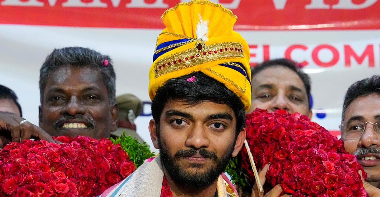 Gukesh being welcomed on his arrival at the Chennai airport. Photo: PTI/R Senthil Kumar