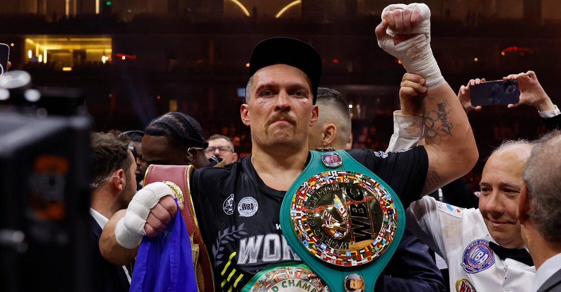 Oleksandr Usyk celebrates with the belts after the bout. Photo: Photo: Action Images via Reuters/Andrew Couldridge