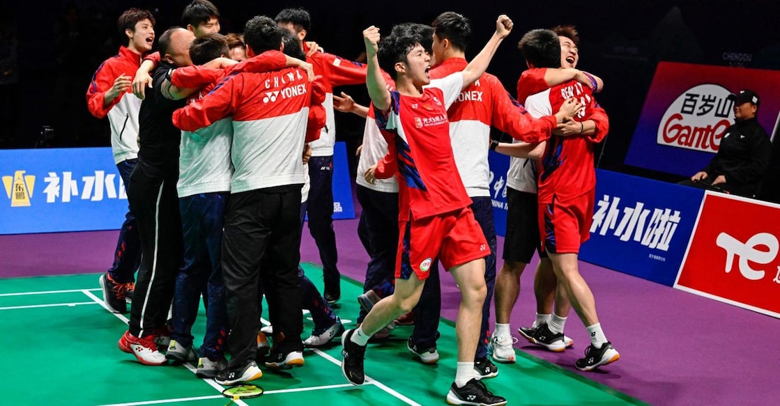 Chinese players and support staff celebrate their Thomas Cup triumph. Photo: AFP/Wang Zhao