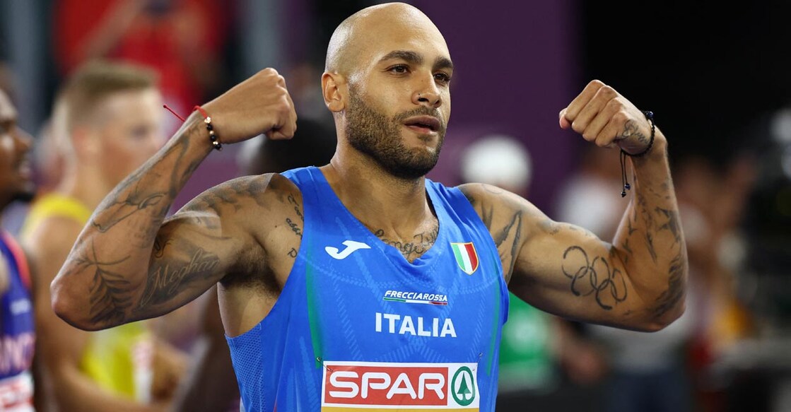Italy's Lamont Marcell Jacobs celebrates winning the men's 100m final. Photo: Reuters/Kai Pfaffenbach
