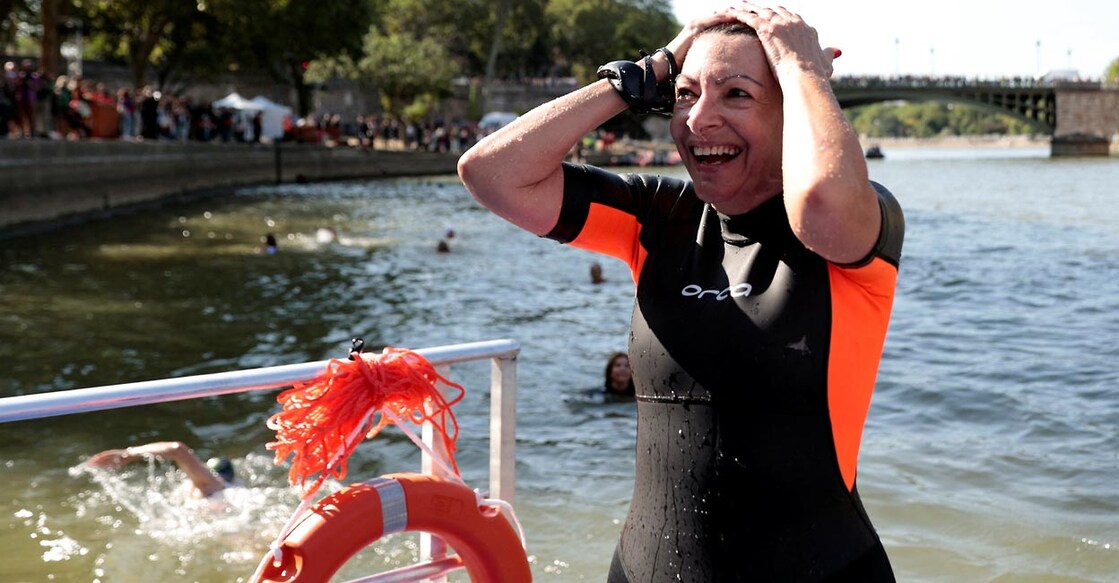 Paris Mayor Anne Hidalgo reacts after swimming in the Seine. Photo: Reuters/Abdul Saboor