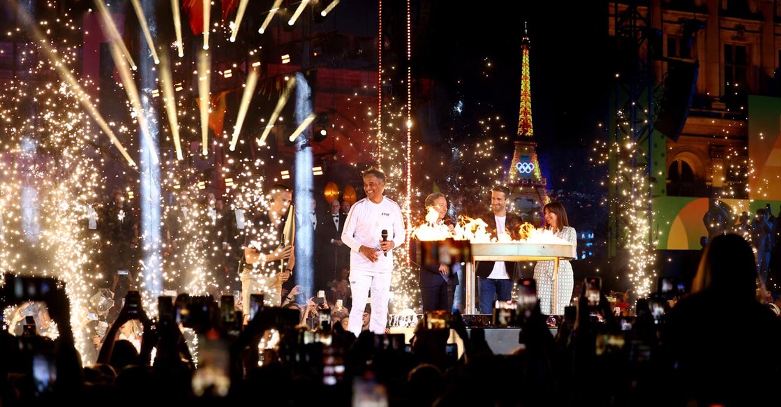 Yannick Noah, Tony Estanguet, Stephane Bern and Anne Hidalgo during the lighting of the cauldron ceremony in Paris. File photo: Reuters/Stephanie Lecocq