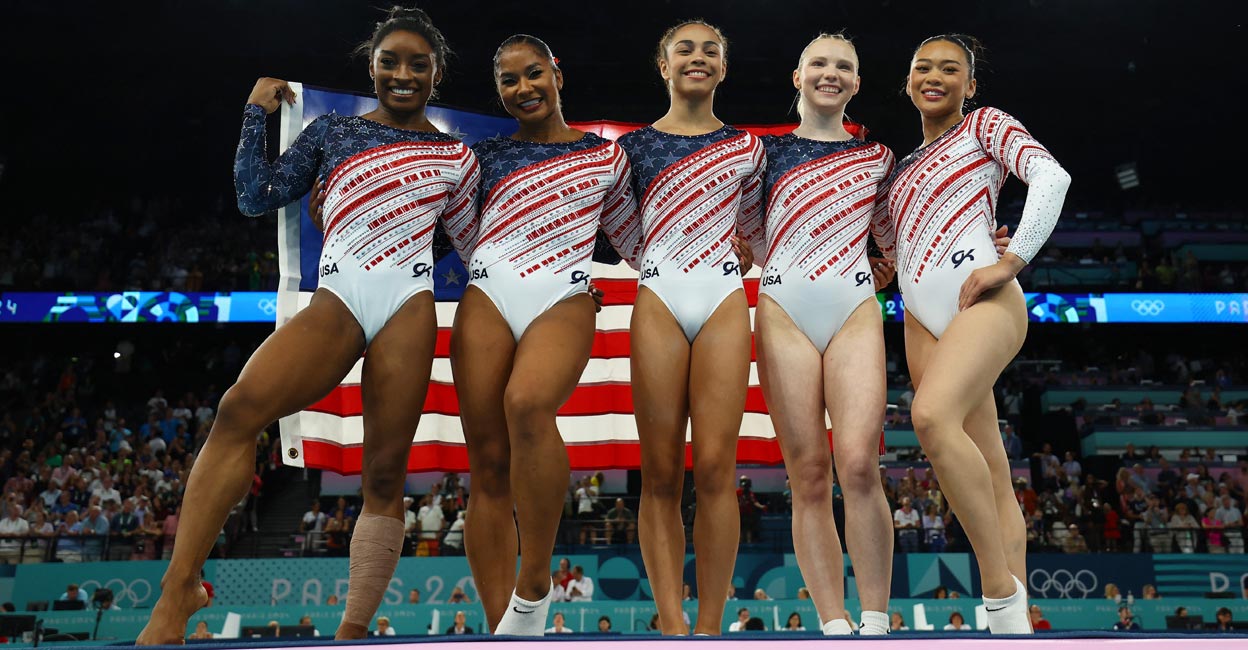 From left: Simone Biles, Jordan Chiles, Jade Carey, Sunisa Lee and Hezly Rivera celebrate their triumph. Photo: Reuters/Hannah Mckay