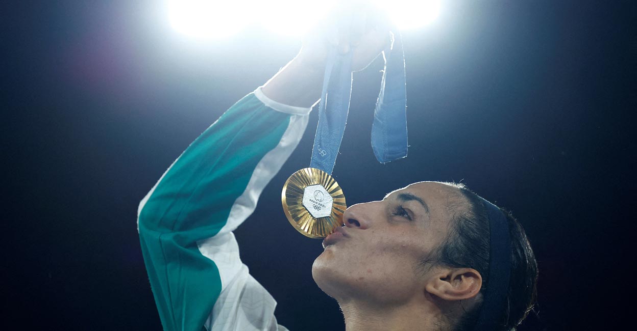 Imane Khelif Imane Khelif celebrates with the gold medal. Photo: Reuters/ Peter Cziborra