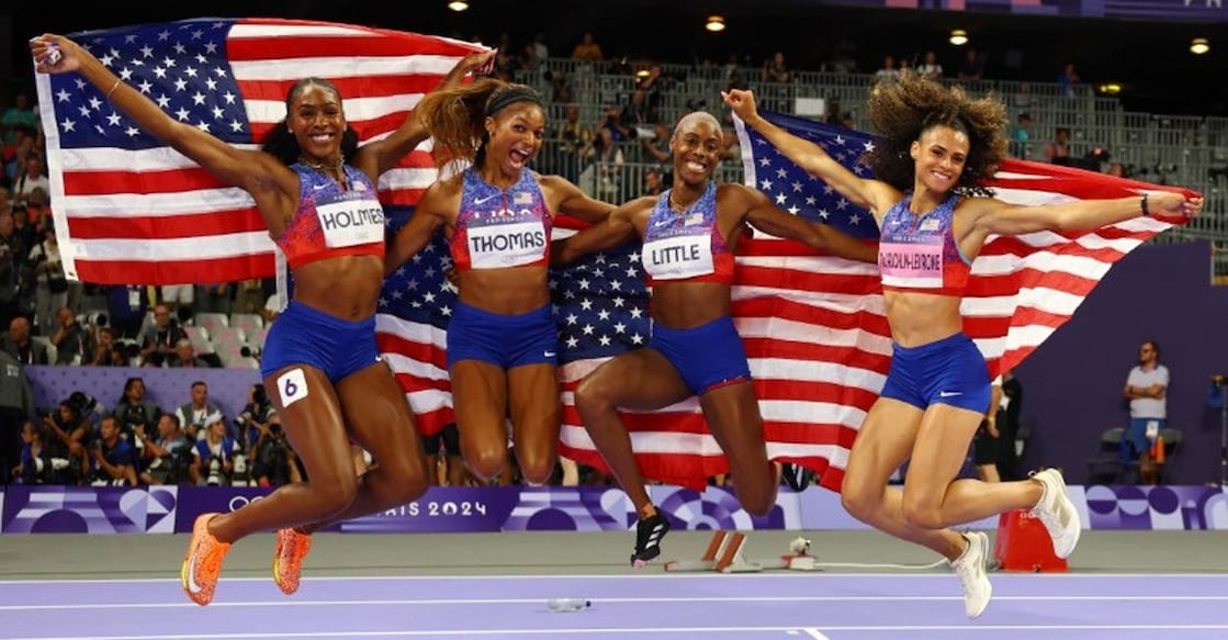 From left: Alexis Holmes,  Gabrielle Thomas, Shamier Little and Sydney McLaughlin-Levrone celebrate after winning the gold. Photo: Reuters/Kai Pfaffenbach