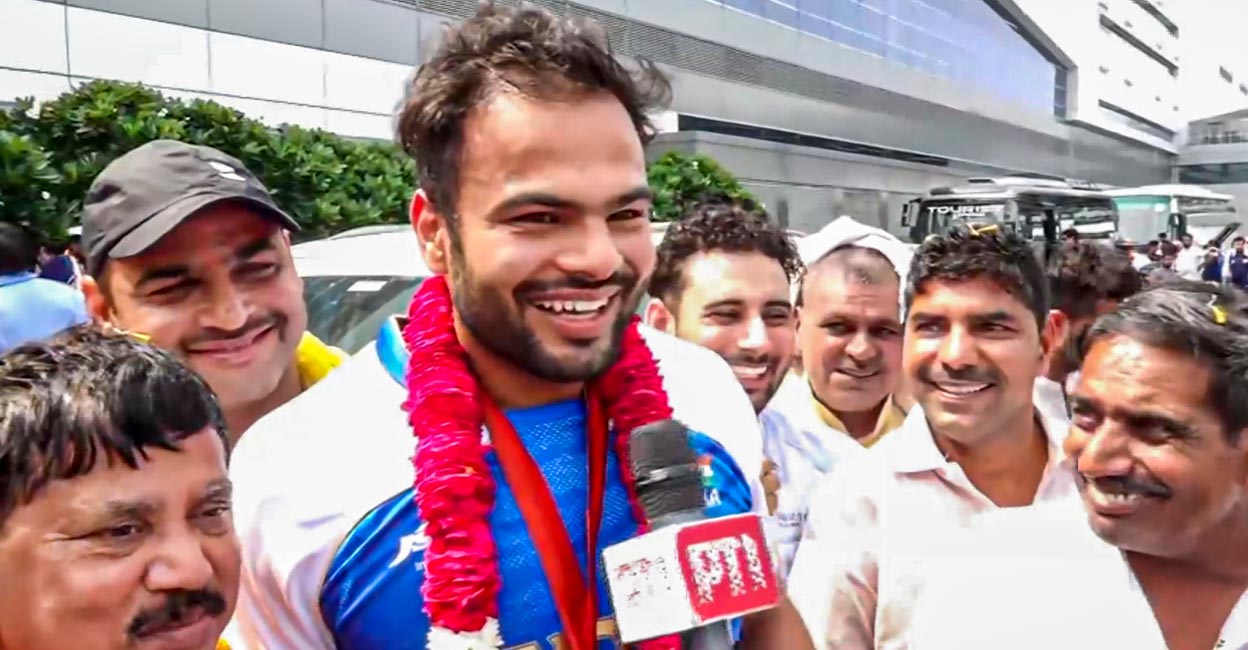 Paralympics gold medallist Sumit Antil speaks to the media on his arrival at New Delhi. Photo: PTI