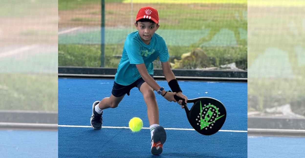 A boy enjoys his first attempt at padel on a freshly inaugurated court at Padel High in Kochi. Photo: Special arrangement