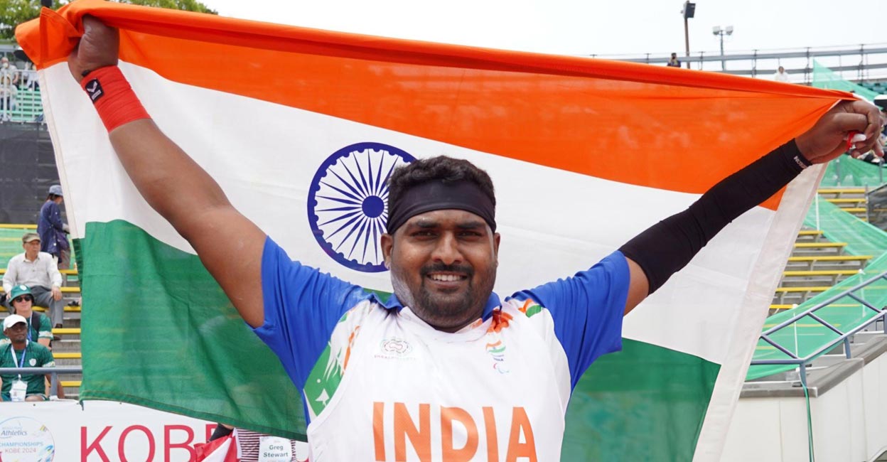 Sachin Sarjerao Khilari Sachin Sarjerao Khilari celebrates with the tricolour. Photo: X@ParalympicIndia via IANS