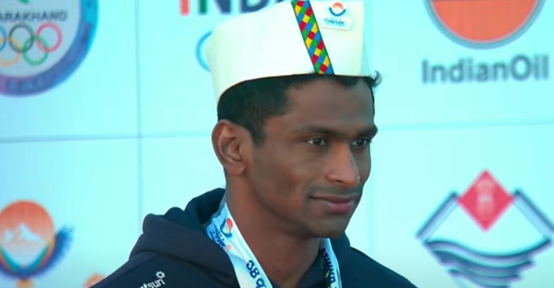 Sajan Prakash poses on the podium after bagging silver medal in 200 m medley. Photo: Screengrab/YouTube @PrasarBhartiSports