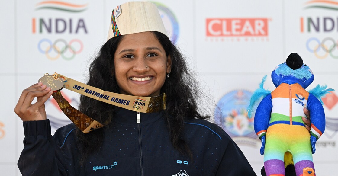 Harshitha Jayaram poses with her gold medal in the 38th National Games in Uttarakhand. Photo: Manorama