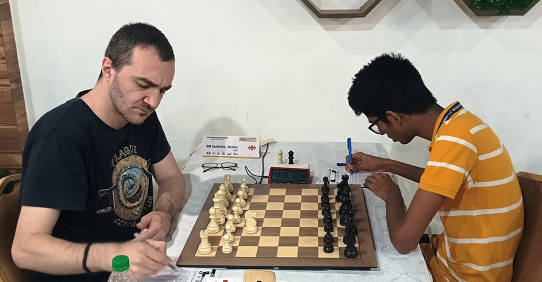 tornike-vs-ahaz-chess GM Sanikidze Tornike of Georgia in action against Kerala’s Ahaz E U in round four of the 1st GM International at Kanjikuzhy in Kottayam on May 2, 2025. Photo: Special arrangement