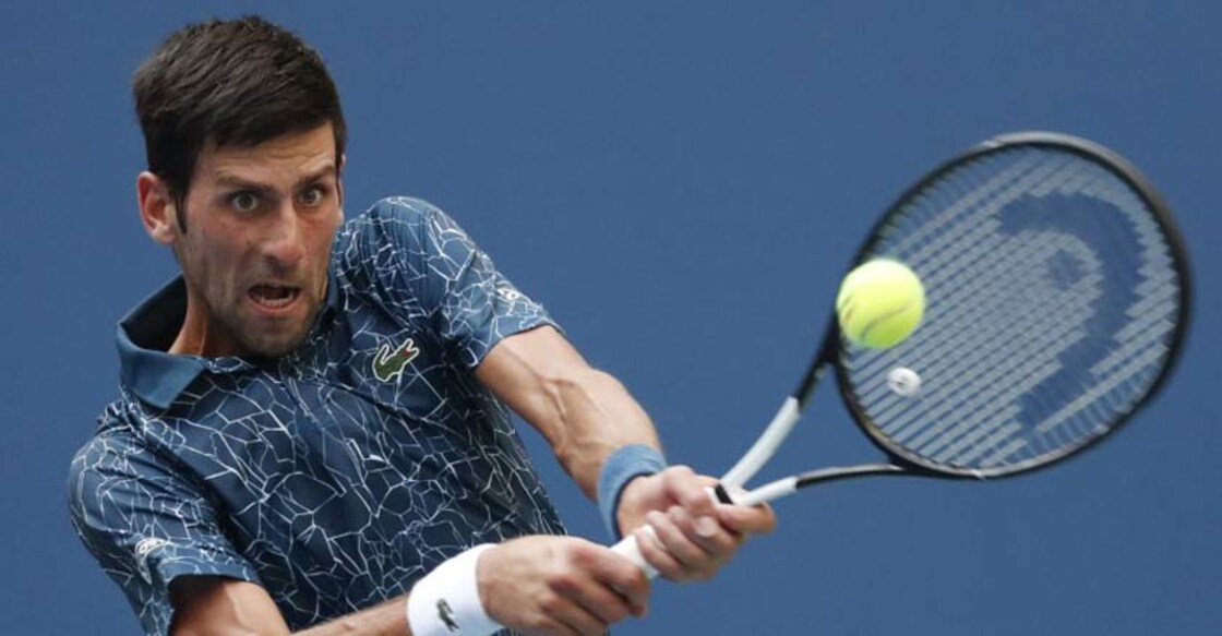 Djokovic battles through brutal heat to topple Fucsovics