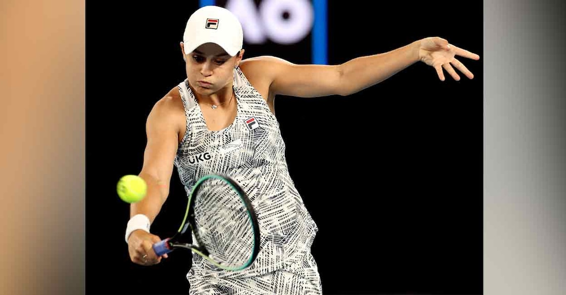 Australia's Ashleigh Barty hits a return to Italy's Camila Giorgi during their women's singles match on day five of the Australian Open tennis tournament in Melbourne on Friday. Photo: AFP