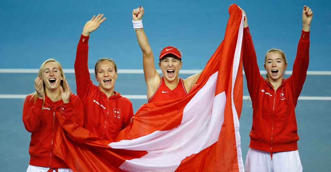 Switzerland's Belinda Bencic celebrates with her team after winning her match in the final against Australia's Ajla Tomljanovic REUTERS/Ed Sykes