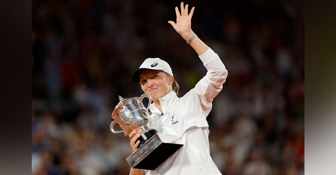 Poland's Iga Swiatek celebrtes with trophy after winning the women's singles final match against Coco Gauff of the US. Photo: Reuters/ Gonzalo Fuentes