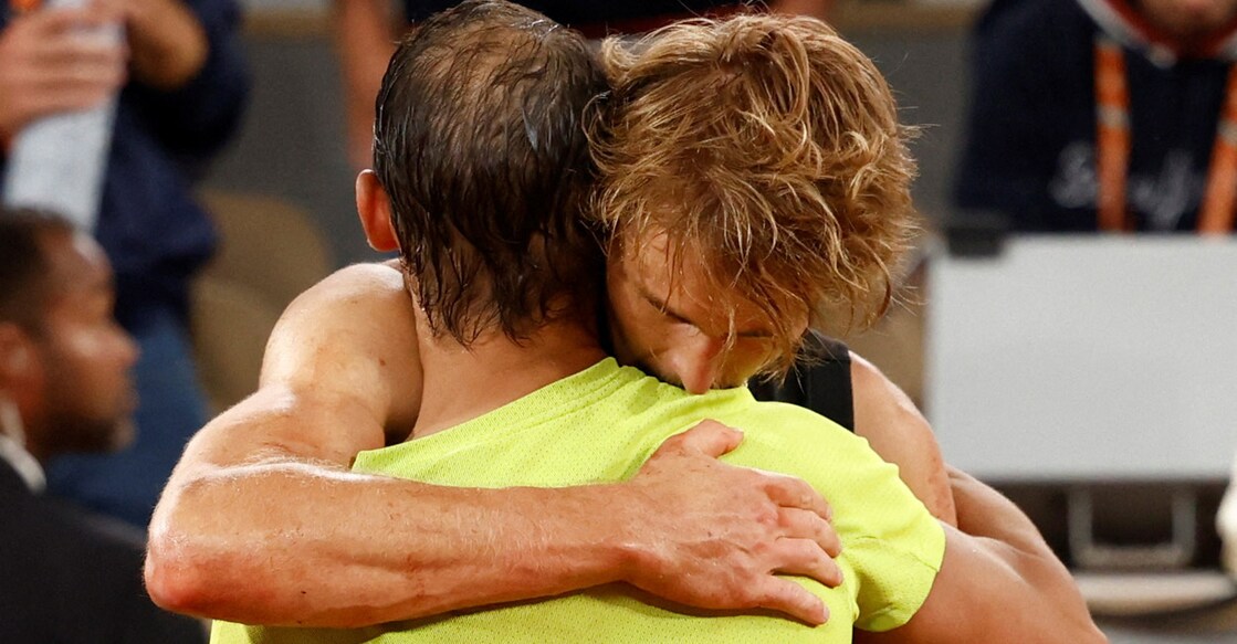 Alexander Zverev hugs Rafael Nadal as he retires from the French Open semifinal after sustaining an injury. Photo: Reuters/Yves Herman