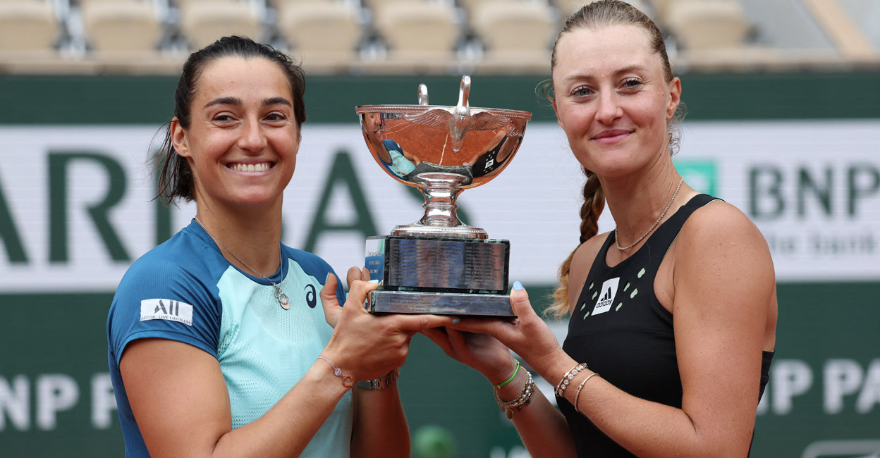 Caroline Garcia and Kristina Mladenovic pose with the trophy. Photo: AFP/Thomas Samson