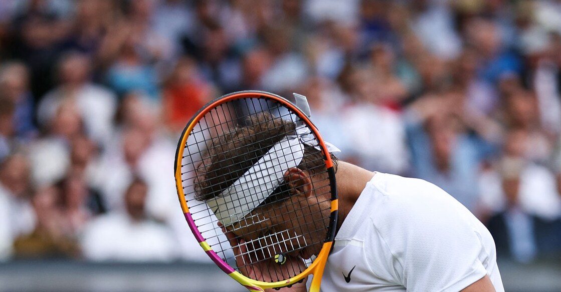 Spain's Rafael Nadal reacts after missing a shot against US player Taylor Fritz during their men's singles quarterfinal. Photo: AFP