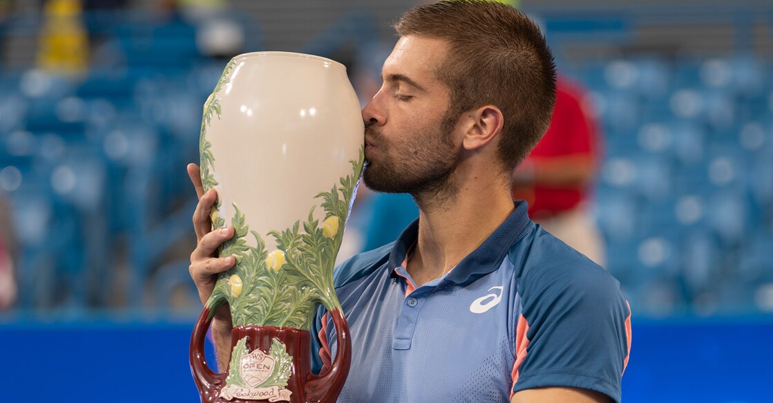 Borna Coric kisses the trophy. Photo: USA TODAY Sports/Reuters/Susan Mullane