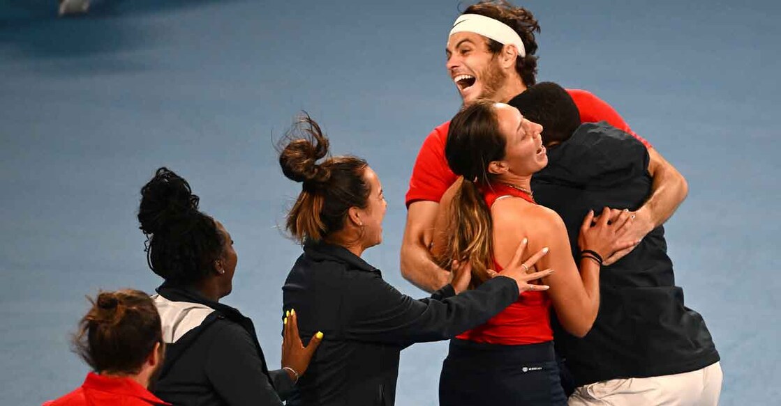 Taylor Fritz of the US celebrates with teammates after beating Matteo Berrettini to wrap up the tie. Photo: AFP/Saeed Khan 
