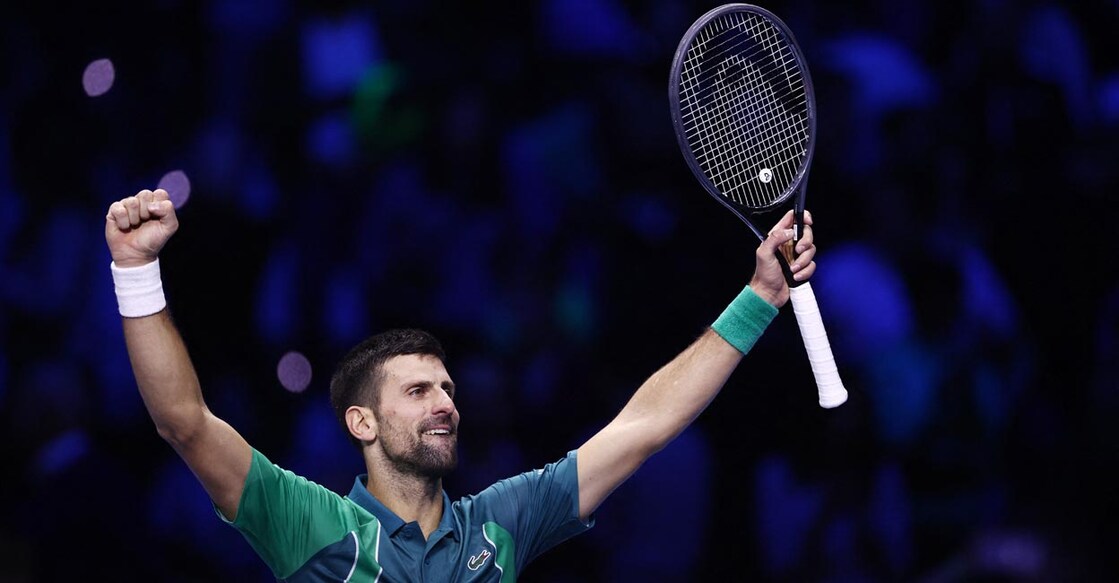 Novak Djokovic celebrates after winning the semifinal against Carlos Alcaraz. Photo:  Reuters/Guglielmo Mangiapane