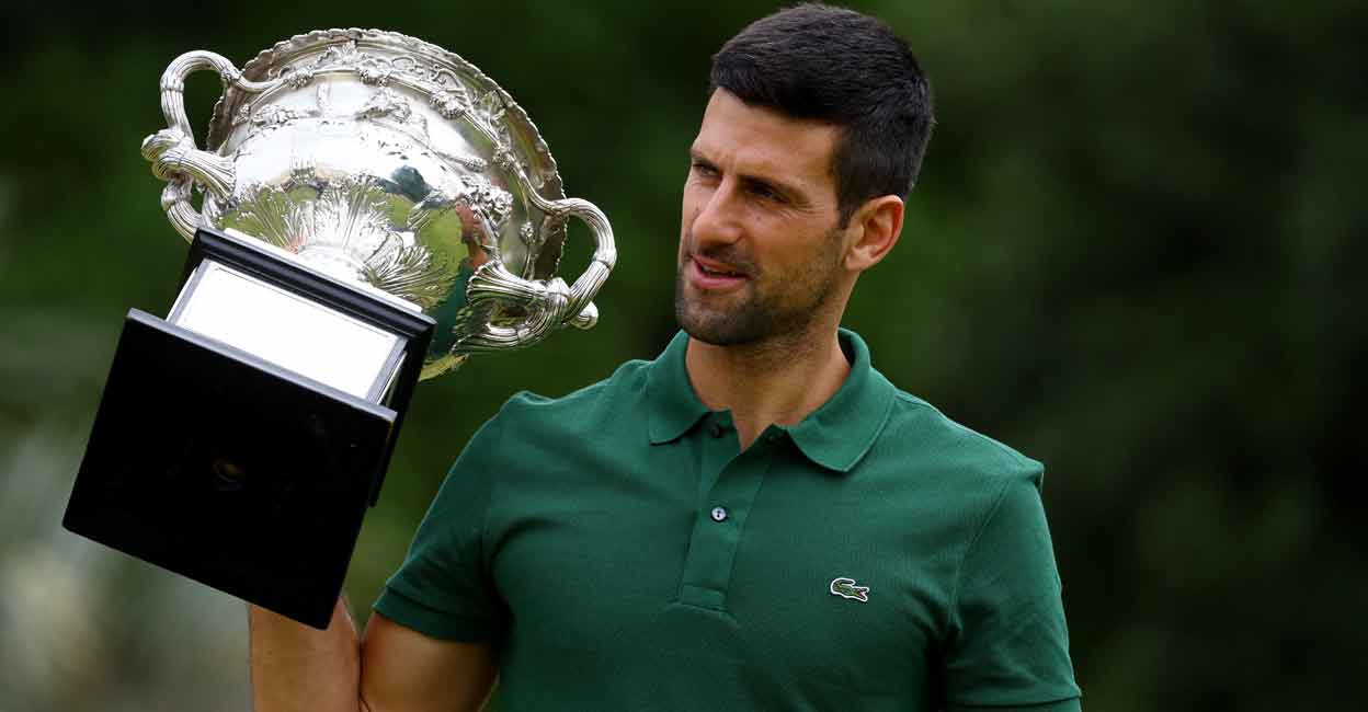 Australian Open champion Novak Djokovic poses with the trophy during a photo shoot. File photo: Reuters/Hannah Mckay
