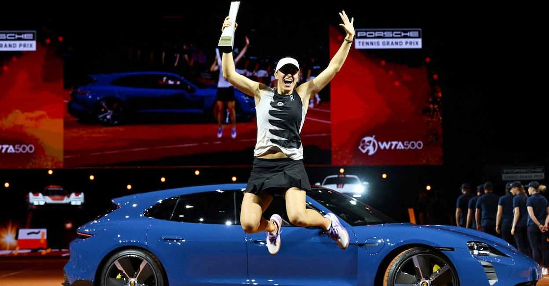 Iga Swiatek Iga Swiatek celebrates with the trophy. Photo: Reuters/Angelika Warmuth