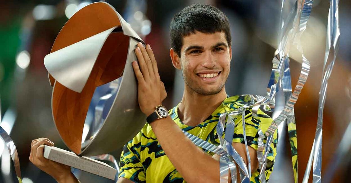 Carlos Alcaraz celebrates with the trophy after winning the final. Photo: Reuters: Juan Medina