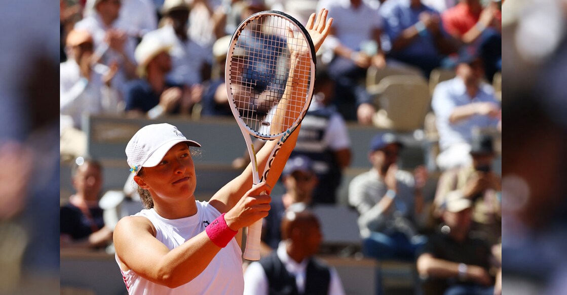 Poland's Iga Swiatek celebrates winning her third round match against China's Xinyu Wang. Photo: Reuters/Kai Pfaffenbach