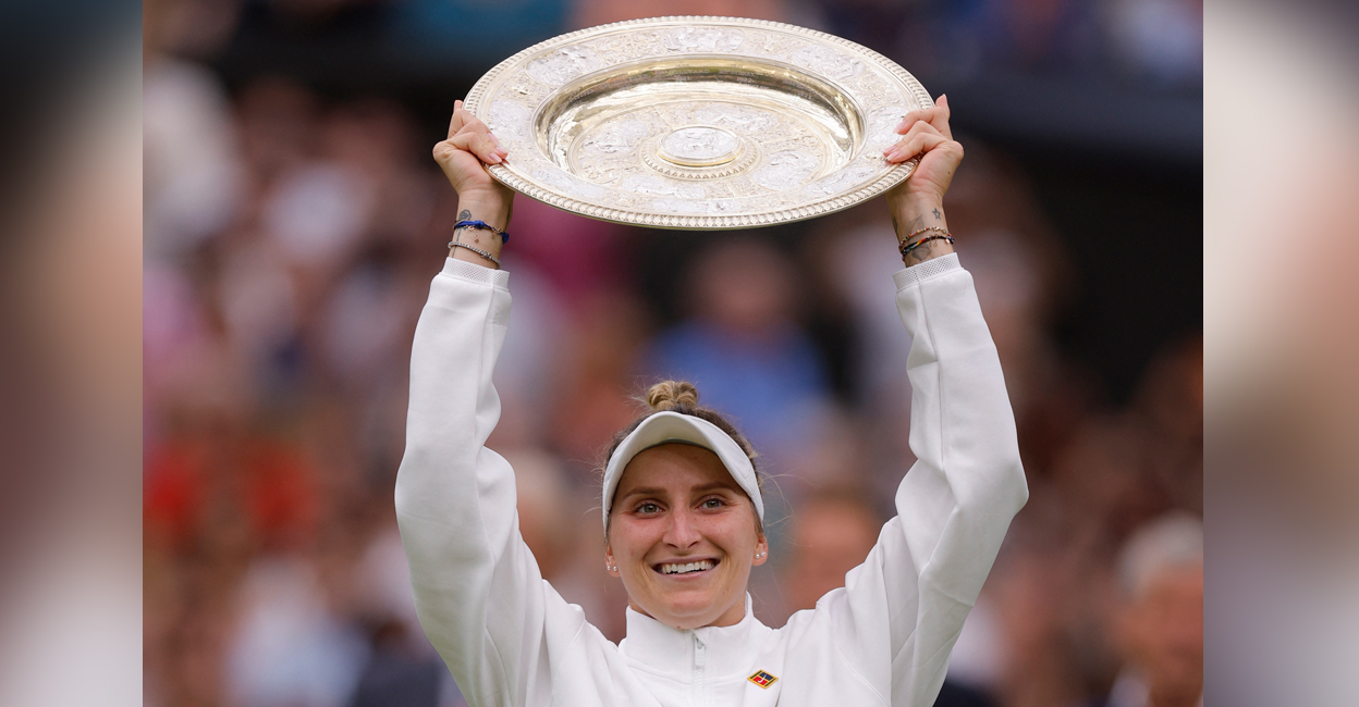 Czech Republic's Marketa Vondrousova celebrates with the trophy winning her final match against Tunisia’s Ons Jabeur. Photo: Reuters/Andrew Couldridge