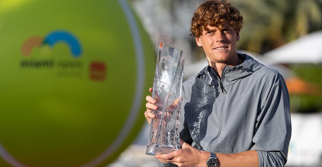 Jannik Sinner poses with the trophy. Photo: AFP/Brennan Asplen
