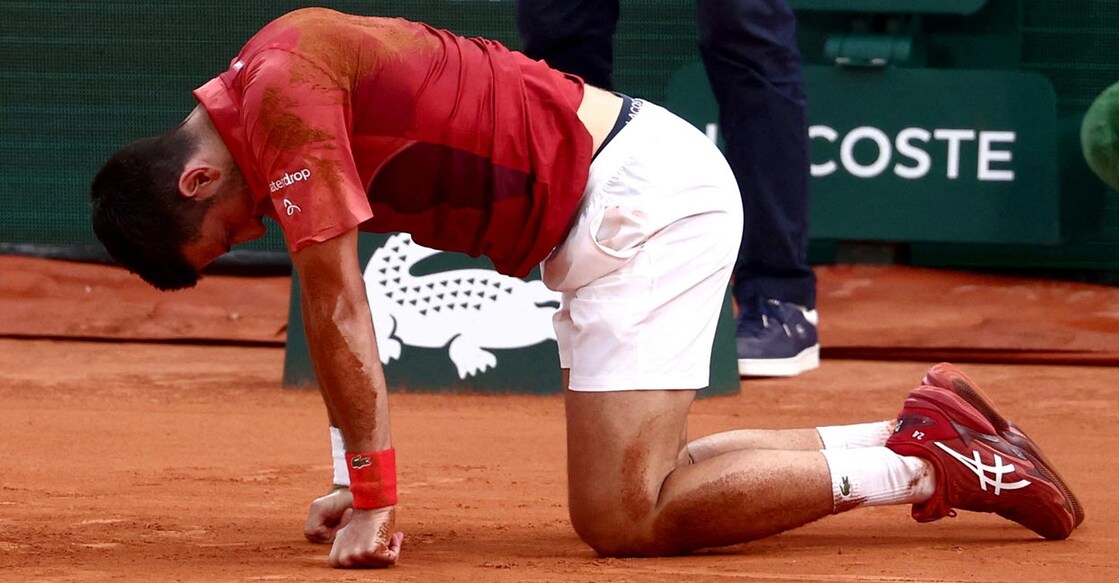 Novak Djokovic reacts after falling during the match against Francisco Cerundolo. Photo: Reuters/Yves Herman