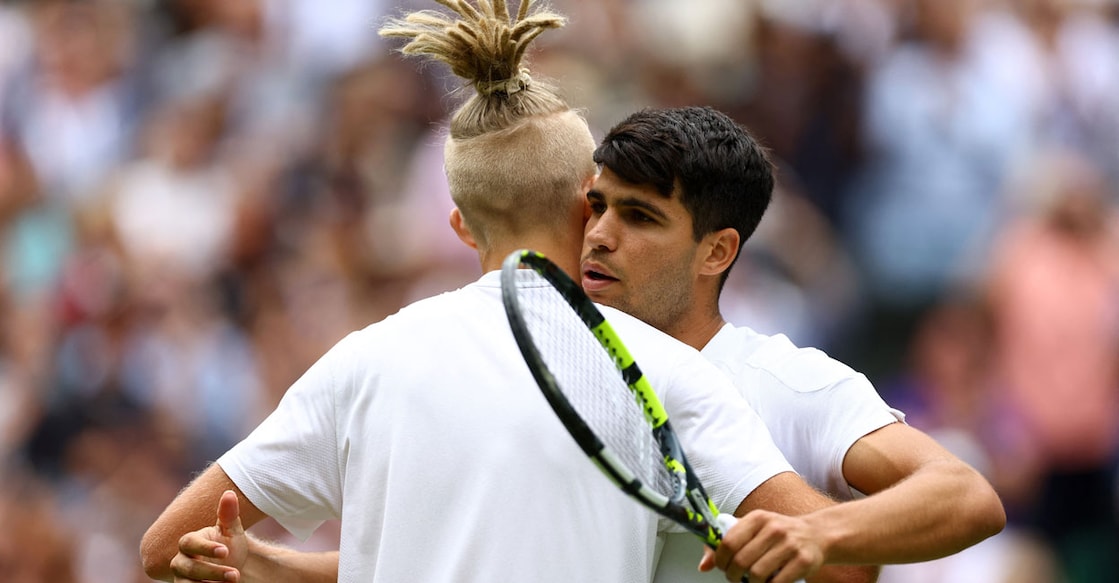 Spain's Carlos Alcaraz hugs Estonia's Mark Lajal after winning his first round match. Photo: Reuters/Hannah Mckay