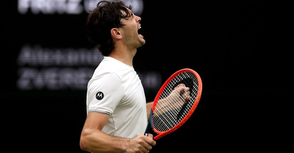 Taylor Fritz of the US celebrates after winning his fourth round match against Germany's Alexander Zverev. Photo: Reuters/Paul Childs