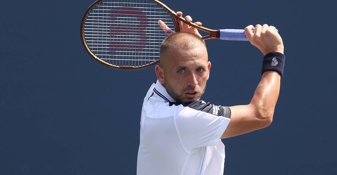 Daniel Evans of Great Britain returns against Karen Khachanov of Russia during their Men's Singles First Round match on Day Two of the 2024 US Open. Photo: Jamie Squire/ AFP